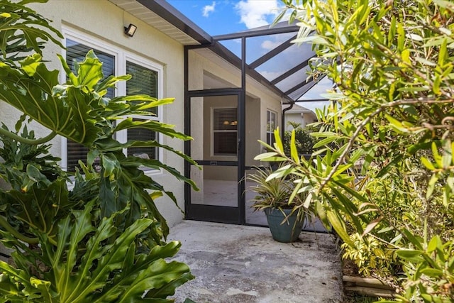4402 Natures Reach Ter, Parrish, FL 34219 - doorway to property featuring stucco siding and a patio area