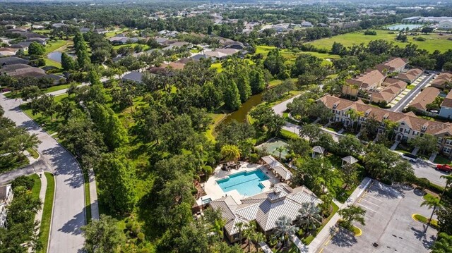 4402 Natures Reach Ter, Parrish, FL 34219 - aerial perspective of suburban area featuring a pool and a large body of water