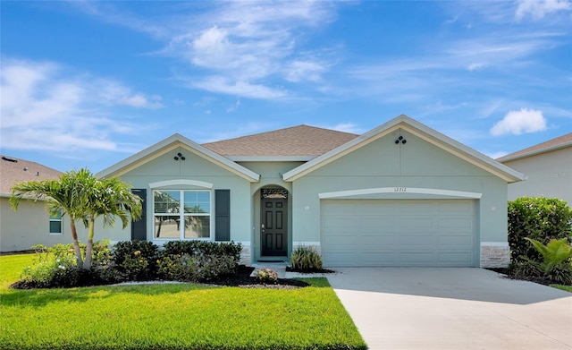 12712 Dusty Trail Dr, Sarasota, FL 34238 - ranch-style house featuring a front yard, concrete driveway, an attached garage, stucco siding, and a shingled roof