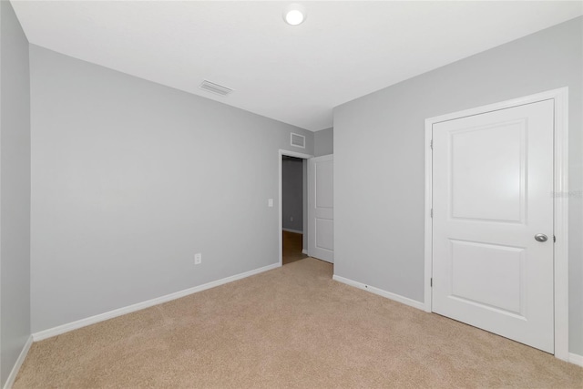 12712 Dusty Trail Dr, Sarasota, FL 34238 - unfurnished bedroom featuring light colored carpet and baseboards