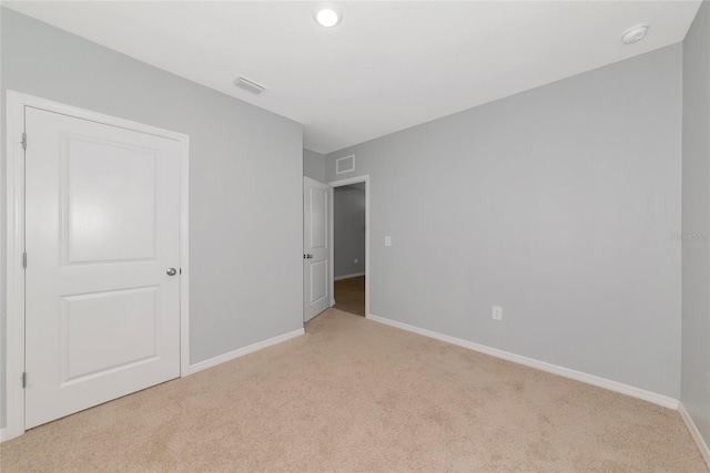 12712 Dusty Trail Dr, Sarasota, FL 34238 - unfurnished bedroom featuring light colored carpet and baseboards