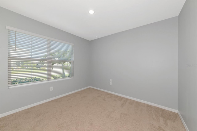 12712 Dusty Trail Dr, Sarasota, FL 34238 - unfurnished room with light carpet, baseboards, and recessed lighting
