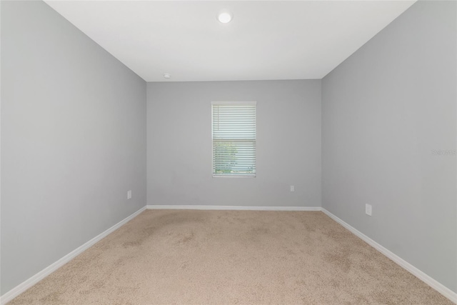 12712 Dusty Trail Dr, Sarasota, FL 34238 - spare room with light colored carpet, baseboards, and recessed lighting