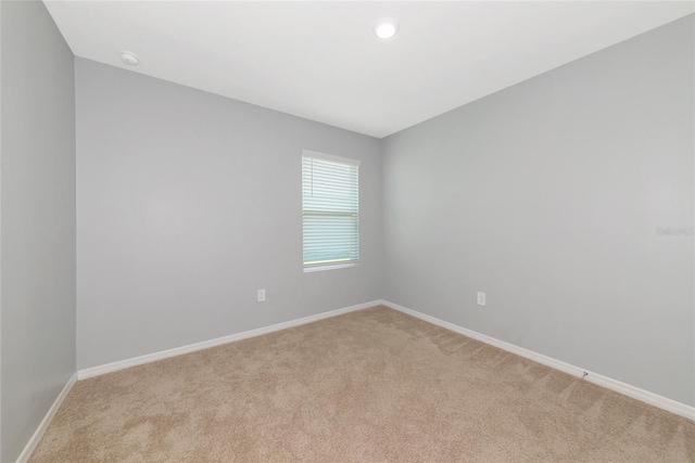12712 Dusty Trail Dr, Sarasota, FL 34238 - spare room featuring light carpet, baseboards, a smoke detector, and recessed lighting