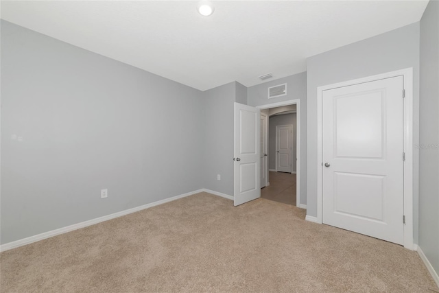 12712 Dusty Trail Dr, Sarasota, FL 34238 - unfurnished bedroom with light colored carpet and baseboards