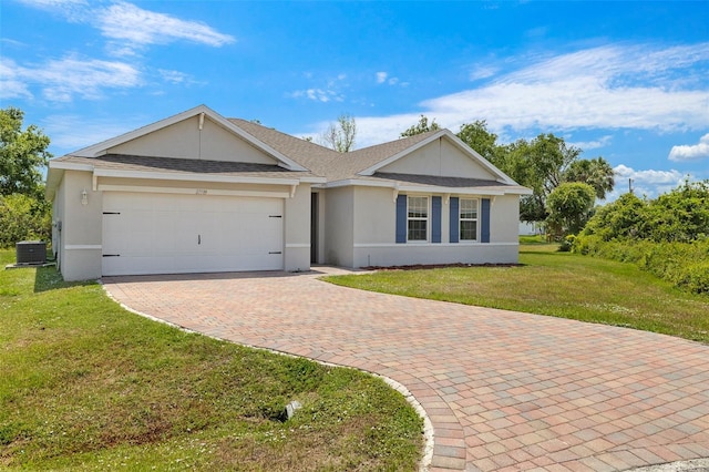 27519 Pasto Dr, Punta Gorda, FL 33983 - ranch-style home with an attached garage, central AC, decorative driveway, a front lawn, and stucco siding