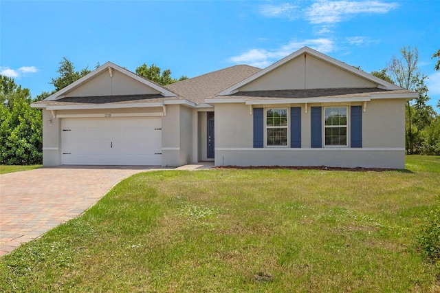 27519 Pasto Dr, Punta Gorda, FL 33983 - ranch-style home with a garage, decorative driveway, a front yard, stucco siding, and roof with shingles
