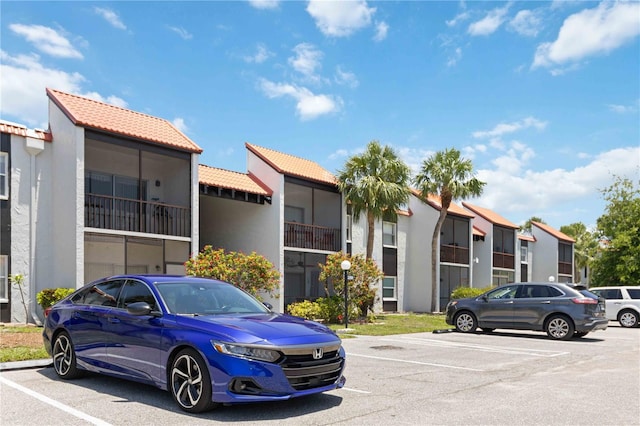 3269 Beneva Rd Unit 103, Sarasota, FL 34232 - view of building exterior featuring uncovered parking and a residential view