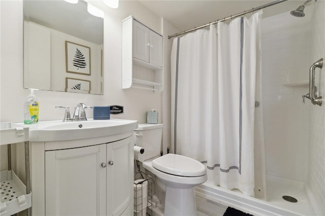3269 Beneva Rd Unit 103, Sarasota, FL 34232 - bathroom featuring a shower stall, toilet, and vanity