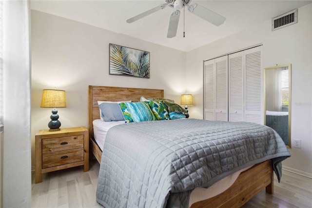 3269 Beneva Rd Unit 103, Sarasota, FL 34232 - bedroom featuring wood finished floors, a closet, ceiling fan, and baseboards