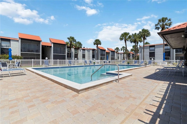 3269 Beneva Rd Unit 103, Sarasota, FL 34232 - community pool featuring a patio, fence, and a residential view