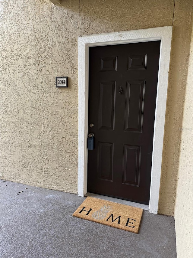4037 Crockers Lake Blvd Unit 14, Sarasota, FL 34238 - entrance to property with stucco siding