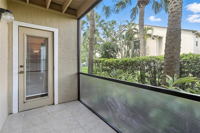 4037 Crockers Lake Blvd Unit 14, Sarasota, FL 34238 - unfurnished sunroom featuring plenty of natural light