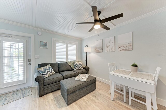301 Highland Ave Unit 3, Bradenton Beach, FL 34217 - living area featuring a ceiling fan, light wood-style floors, ornamental molding, and baseboards