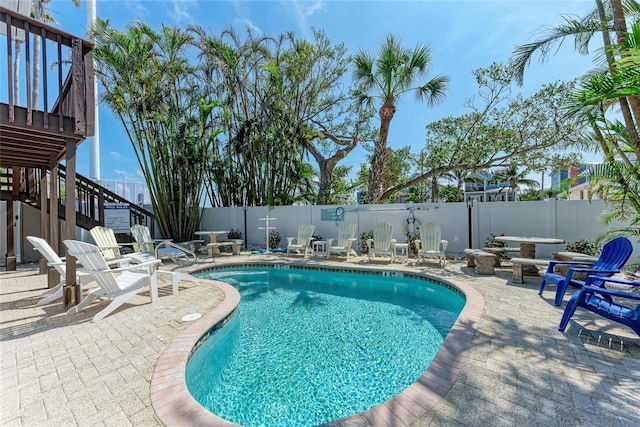 301 Highland Ave Unit 3, Bradenton Beach, FL 34217 - view of swimming pool featuring stairs, a patio, and a fenced backyard