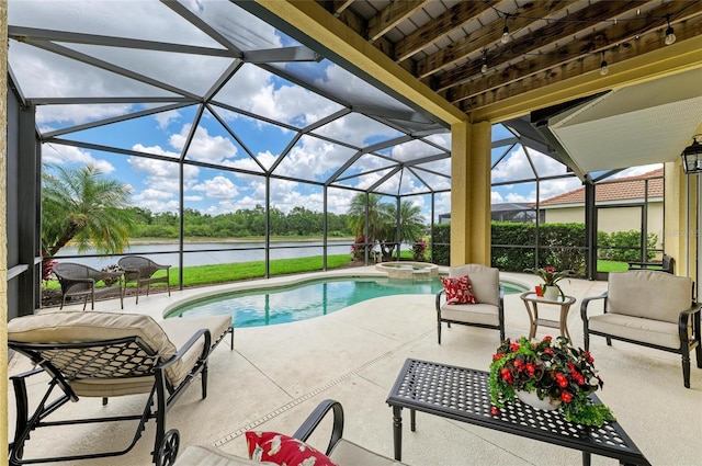 view of pool with a water view, a patio area, glass enclosure, and a pool with connected hot tub