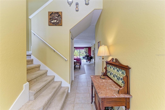 staircase with tile patterned flooring