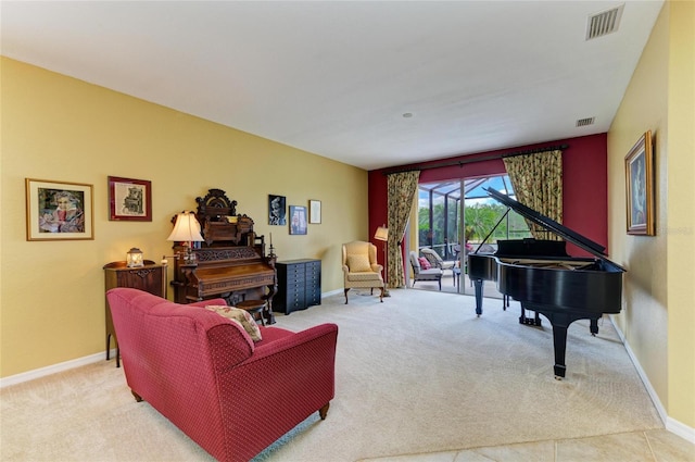 living room with carpet and baseboards