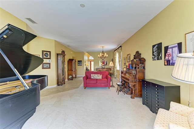 carpeted living room with a chandelier