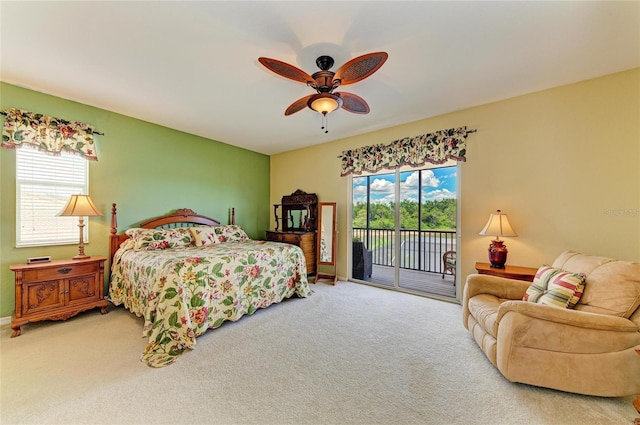 bedroom featuring access to outside, carpet flooring, and a ceiling fan