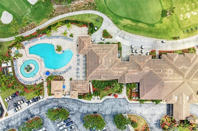 aerial view of property's location featuring a pool area