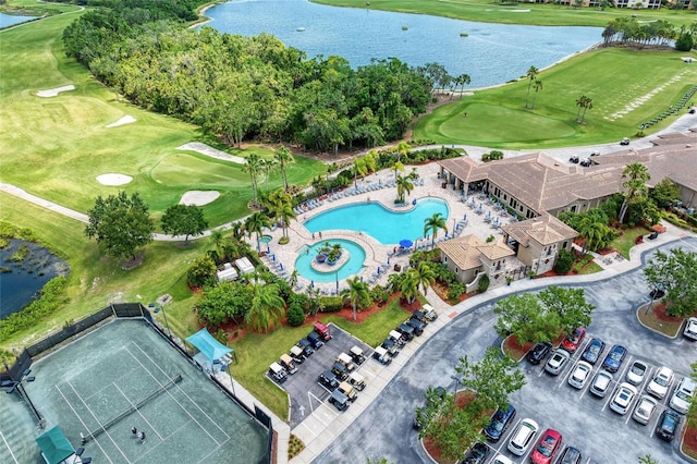 bird's eye view of a large body of water, a pool area, and a golf club