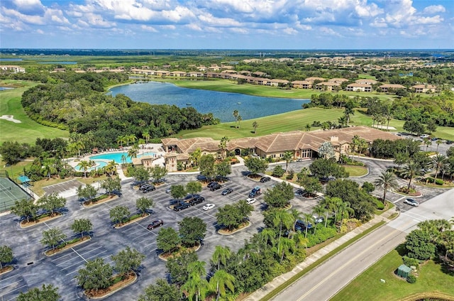 bird's eye view of a large body of water, a golf course, and a pool