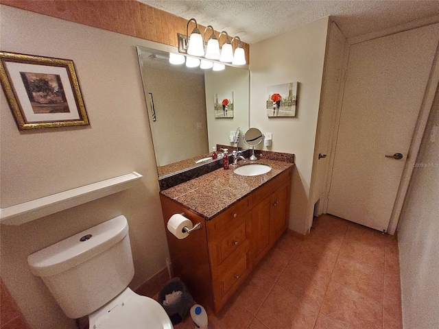 4607 W N B St Unit 105, Tampa, FL 33609 - bathroom featuring vanity, tile patterned floors, and a textured ceiling