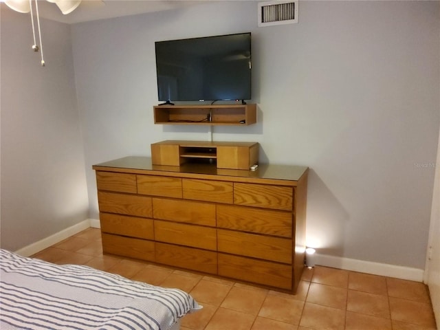 4607 W N B St Unit 105, Tampa, FL 33609 - bedroom featuring light tile patterned floors and baseboards