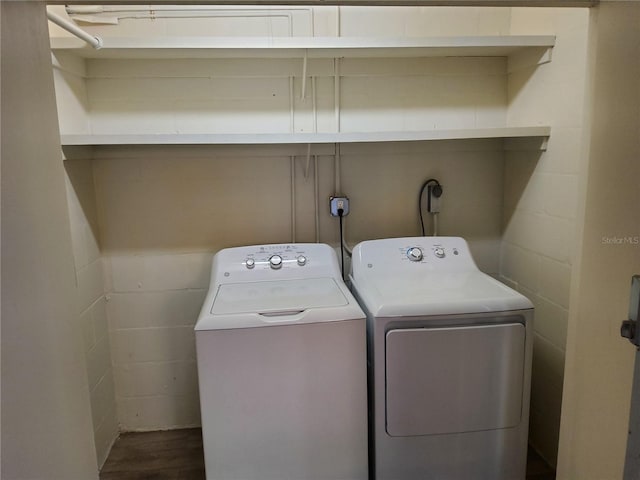 4607 W N B St Unit 105, Tampa, FL 33609 - laundry room featuring independent washer and dryer and dark wood-type flooring