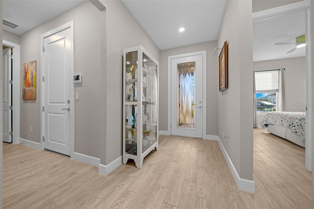 6185 SW 89th Ct, Ocala, FL 34481 - foyer entrance with light wood-style flooring, baseboards, and recessed lighting