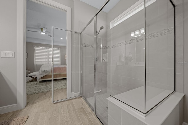 6185 SW 89th Ct, Ocala, FL 34481 - bathroom with wood finished floors, a shower stall, connected bathroom, a ceiling fan, and baseboards