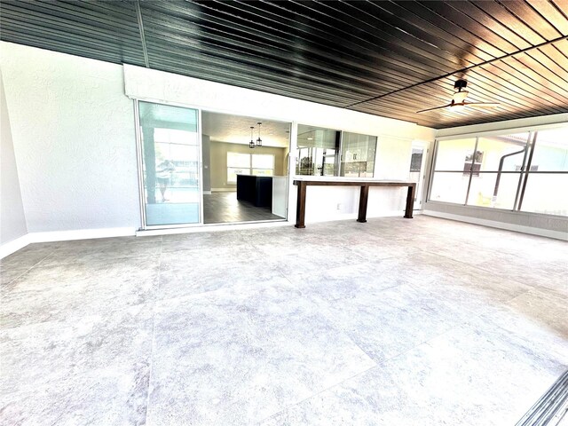 6524 Senegal Palm Way, Apollo Beach, FL 33572 - unfurnished living room featuring baseboards