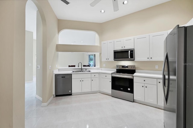 6222 Country Club Way, Sarasota, FL 34243 - kitchen featuring stainless steel appliances, light countertops, white cabinets, and recessed lighting