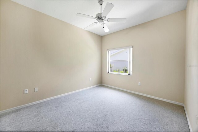 6222 Country Club Way, Sarasota, FL 34243 - empty room with carpet floors, baseboards, and a ceiling fan