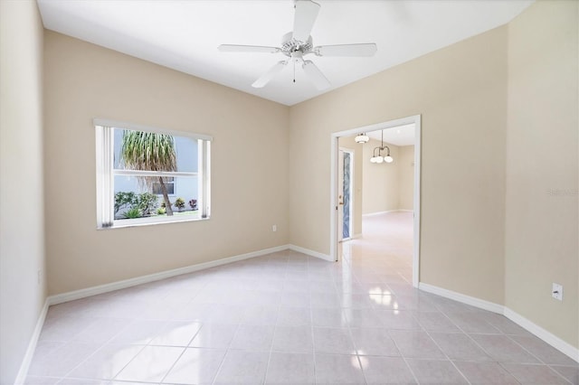 6222 Country Club Way, Sarasota, FL 34243 - spare room with light tile patterned floors, ceiling fan, and baseboards