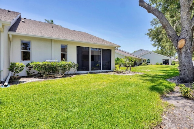 6222 Country Club Way, Sarasota, FL 34243 - rear view of property with a lawn, stucco siding, and roof with shingles