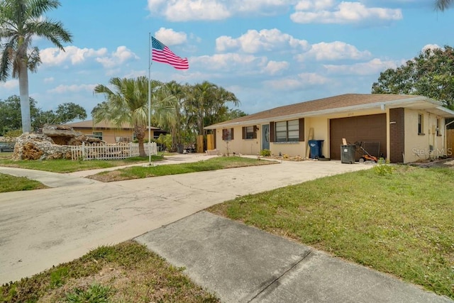 ranch-style home featuring an attached garage and driveway