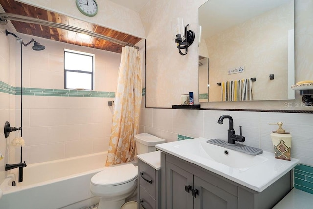 bathroom with toilet, shower / bath combination with curtain, backsplash, vanity, and tile walls