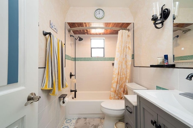 full bathroom with toilet, tile walls, shower / bath combination with curtain, and vanity