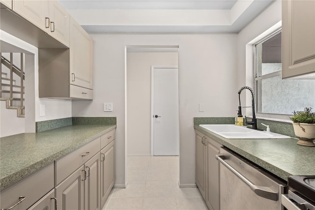 3212 Ramblewood Dr N Unit 3212, Sarasota, FL 34237 - kitchen featuring dishwasher, a sink, light tile patterned floors, and dark countertops