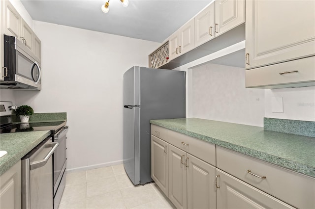 3212 Ramblewood Dr N Unit 3212, Sarasota, FL 34237 - kitchen featuring appliances with stainless steel finishes and baseboards