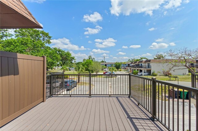 3212 Ramblewood Dr N Unit 3212, Sarasota, FL 34237 - wooden terrace with a residential view