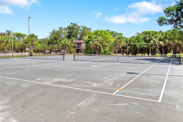 3212 Ramblewood Dr N Unit 3212, Sarasota, FL 34237 - view of tennis court with view of scattered trees