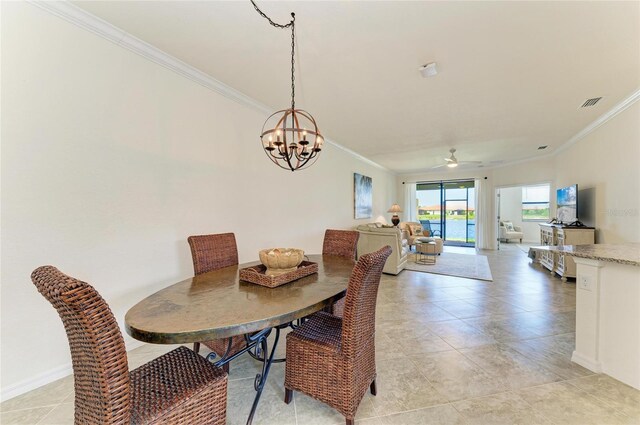 24065 Canterwood Way, Venice, FL 34293 - dining room with crown molding, a chandelier, a ceiling fan, light tile patterned floors, and baseboards