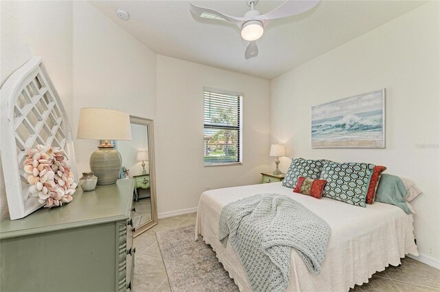 24065 Canterwood Way, Venice, FL 34293 - bedroom with light tile patterned floors, baseboards, and a ceiling fan