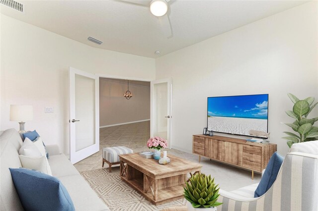 24065 Canterwood Way, Venice, FL 34293 - living area with light tile patterned floors, french doors, and ceiling fan
