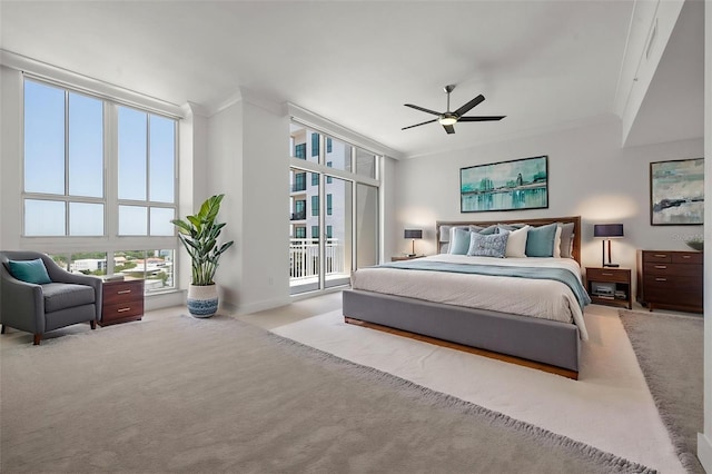 1350 Main St Unit 1703, Sarasota, FL 34236 - bedroom featuring carpet, crown molding, multiple windows, and access to outside