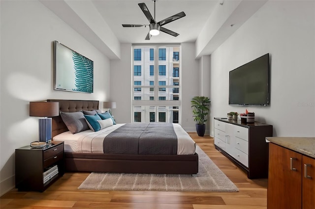 1350 Main St Unit 1703, Sarasota, FL 34236 - bedroom with light wood finished floors and ceiling fan