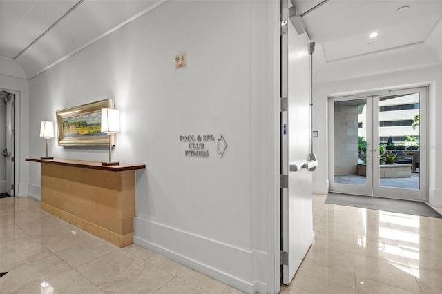 1350 Main St Unit 1703, Sarasota, FL 34236 - hallway featuring tile patterned floors, baseboards, and french doors